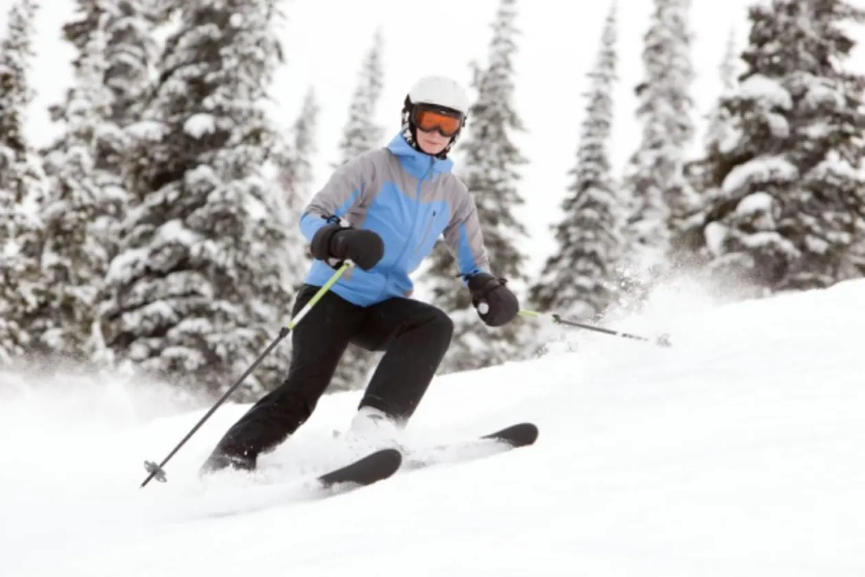 Woman skiing a steep slope